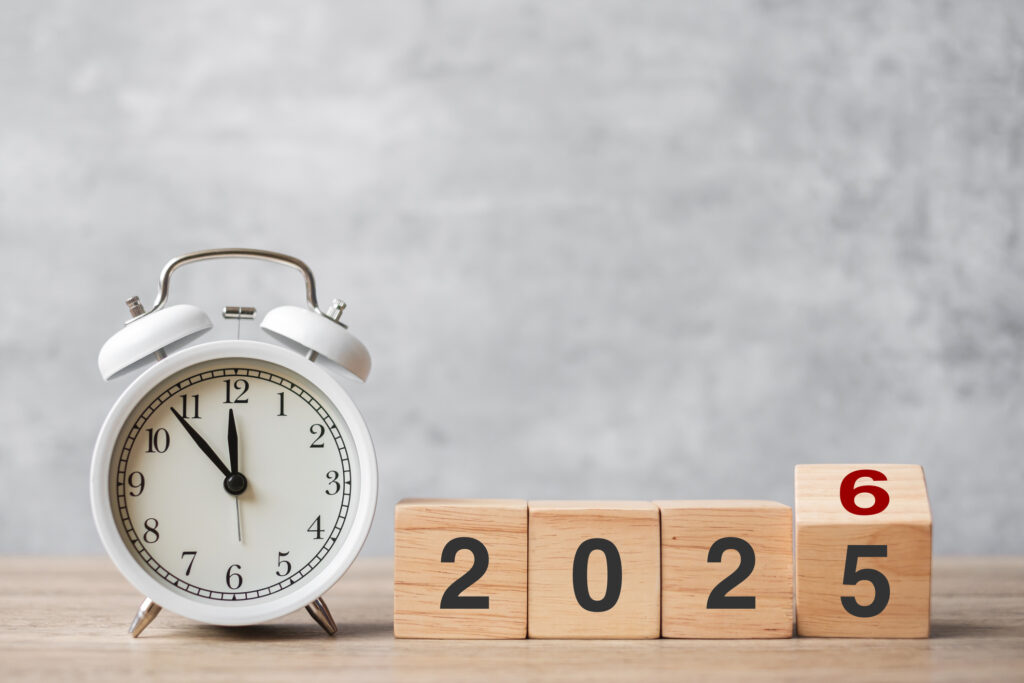 happy new year with vintage alarm clock and flipping 2025 change to 2026 block. christmas, new start, resolution, countdown, goals, plan, action and motivation concept